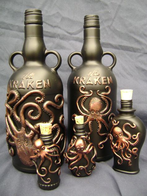 A collection of bottles embellished with many octopii! Two Kraken Rum bottles made in the style of the Kraken logo, three small generic octopii bottles. Figures are sculpted in epoxy and painted with a metallic finish. Kraken Rum, Octopus Decor, Rum Bottle, Halloween Bottles, Halloween Potions, Alcohol Bottles, Altered Bottles, Gothic Steampunk, Liquor Bottles