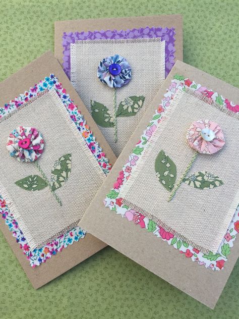 This is what you do with left over pattern paper, fabric and buttons. Brilliant. Quilted Fabric Cards Handmade, Cards With Fabric Flowers, Fabric Flower Cards, Fabric Birthday Cards Handmade, Fabric Cards Handmade, Fabric Greeting Cards, Sewing Inspiration Projects, Cards With Flowers, Patchwork Cards