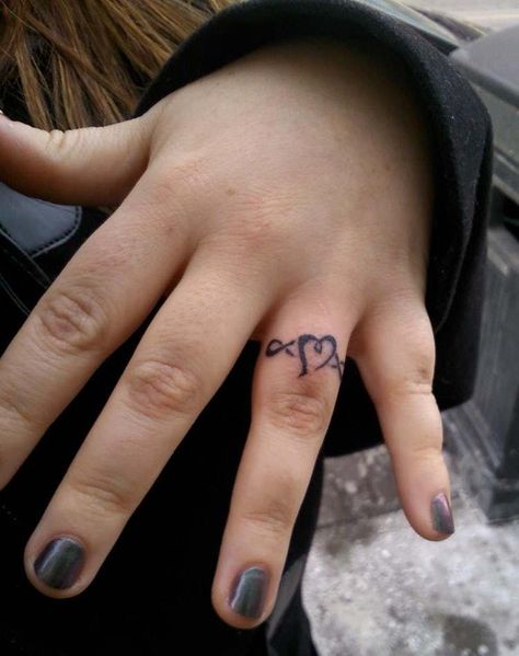 Heart With Infinity Ring Tatto is listed (or ranked) 8 on the list Ring Tattoo Ideas Celtic Ring Tattoo, Heart Ring Tattoo, Ehe Tattoo, Infinity Ring Tattoo, Ring Tattoo Ideas, Finger Tattoos For Couples, Ring Tattoo Designs, Wedding Band Tattoo, Tattoo Wedding