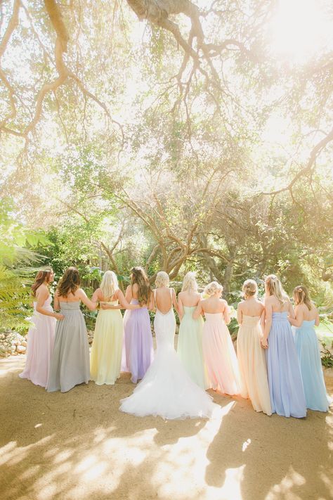 Bridesmaids in pastel rainbow dresses, fairytale wedding, colorful wedding ideas, pastel wedding inspiration, large wedding party Rainbow Wedding Party Bridesmaid Dresses, Different Color Dresses Bridesmaids, Pastel Bridal Party Dresses, Pastel Rainbow Bridesmaids, Pastel Color Wedding Theme Bridesmaid Dresses, Pastel Dress Formal Wedding, Pastel Rainbow Wedding Decorations, Soft Rainbow Wedding, Pastel Colored Bridesmaid Dresses