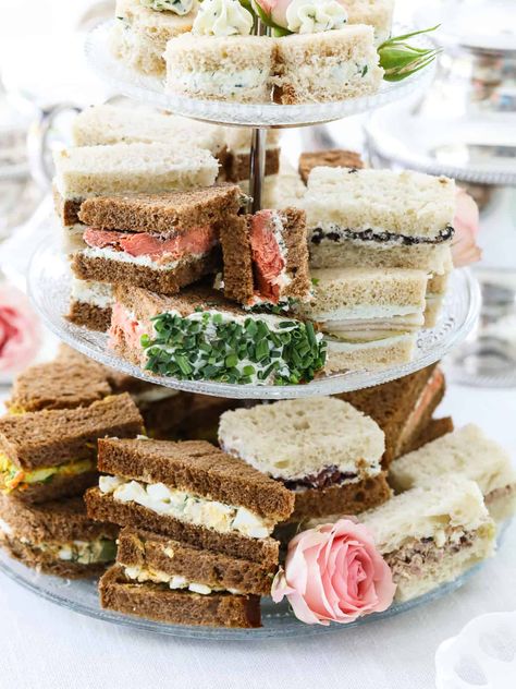 Elegant, dainty, crustless tea sandwiches are quintessential pinkies-up party food for a beautiful light lunch garden party, a bridal shower, or a Mother’s Day brunch. We cover everything from bread choices to filling options, the best ways to make tea sandwiches ahead, and how to create incredible savory flavors. Choose from over two dozen creative small bites from classic cucumber tea sandwiches from Buckingham Palace fit for a Queen, egg salad sandwiches, easy ham salad, and so much more. Tea Party Food Display, Mille Cake, Fall Baby Shower Food Ideas, Fall Baby Shower Food, Roast Beef And Cheddar, Cucumber Tea, Baby Shower Food Ideas, Shower Food Ideas, Smoked Salmon Sandwich