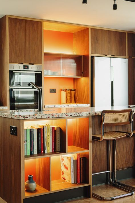 A stunning retro kitchen designed for our client with walnut veneers and a striking terrazzo worktop. The orange in the shelves compliments, with the terrazzo worktops bringing together the shades from around the retro kitchen. Terrazzo Worktop, Modern Walnut Kitchen, Veneer Kitchen, Kitchens Uk, Retro Kitchens, Plywood Kitchen, Veneer Plywood, Canada House, Walnut Kitchen