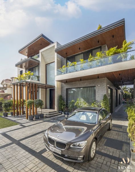 A Modern Design And Tasteful, Elegant Interior Elements For This Luxurious Abode | Amsel Designs - The Architects Diary Modern Elegant House Design Exterior, Indian Modern House Exterior, Architecture Bungalow Design, Best Bungalow Designs, Indian Modern House Design, Modern Home Elevation Design, Modern Villa Elevation Design, Four Storey House Design, Luxury Elevation Design