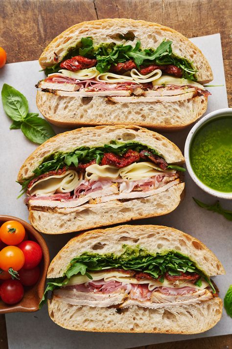 This crowd-pleasing Italian Turkey Club Sandwich is perfect for picnics, parties, or those nights it's just too hot to cook! Loaded with sliced turkey, prosciutto, arugula, sun-dried tomatoes, and a homemade Italian dressing, this recipe is so flavorful and fresh. So without further ado, let's make sandwiches! Turkey Club Sandwich, Club Sandwiches, Stomach Rumbling, Too Hot To Cook, Turkey Sandwiches Recipes, Picnic Sandwiches, Turkey Club, Homemade Italian Dressing, Italian Turkey