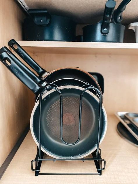 If you’re looking for an easy way to organize your pots and pans under your kitchen cabinet, here is an affordable storage solution. This Amazon Best Seller is sturdy, made well, and worth every penny. And it took less than five minutes to get results that's so satisfying! Kitchen Cabinet Organization Pots Pans, Pot Storage Ideas, Pot Organization Inside Cabinets, Organizing Lids For Pots And Pans, Pot And Pan Organization Cabinet, Small Kitchen Organization Pots And Pans, Organize Under Kitchen Sink, Pots Snd Pan Storage, Under Kitchen Sink