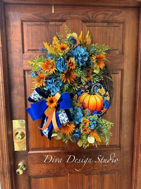 This Fall Pumpkin Wreath  will be a huge statement piece for your main front door and make you the envy of your neighbors, but it doesn't stop there! It would be a beautiful entry point to any fall affair you host. It's also the perfect gift for a new home or as a hostess gift! This autumn design can adorn other places besides a front door in your home:  -over the mantle -powder room  -bathroom -pantry  -side entry door,  -kitchen wall -inside the non-functional fireplace This is a handmade item that I've used quality products to give you a piece that you are proud to hang.  +Wreath measures 28"H X 22"W X 7"D. Measurements are from tip to tip, of the longest ribbon tail, or stem, in the wreath. +Recommended for indoor or covered outdoor use. Your new design will be packaged so that it does Pumpkin Wall Decor, Bathroom Pantry, Fall Hydrangea, Pumpkin Wall, Fall Grapevine Wreaths, Diva Design, Fall Decor Inspiration, Door Kitchen, Autumn Design