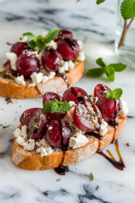 A photo of a  Sparkling Grape Bruschettas a New Years Eve Food Party Ideas Grapes Snack Ideas, 12 Grapes For New Years, Food Party Ideas, Grape Snacks, New Years Eve Snacks, New Years Eve Food, New Year's Food, Snack Board, Food Party