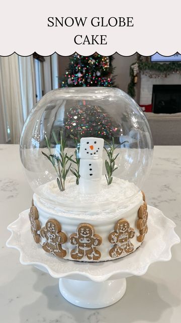 Kelsi || Content Creator on Instagram: "❄️ Snow Globe Cake ❄️⁣ ⁣ Here’s a fun way to turn a regular store bought cake into a magical Christmas cake! I added rosemary sprigs for the Christmas trees and turned these marshmallows into a snowman! Then I put a bowl over the top of the cake making it look like a snow globe! This was so easy and I love how it turned out!⁣ .⁣ .⁣ .⁣ .⁣ #christmas #christmasinspo #christmasideas #christmascake #christmastreat #christmastreats #snowglobe #snowglobes #christmasmagic" Snowglobe Cake, Snow Globe Cake, Snow Globe Cupcakes, Globe Cake, Christmas Food Treats, Snowman Cake, Diy Snow Globe, Store Bought Cake, Baking Goods