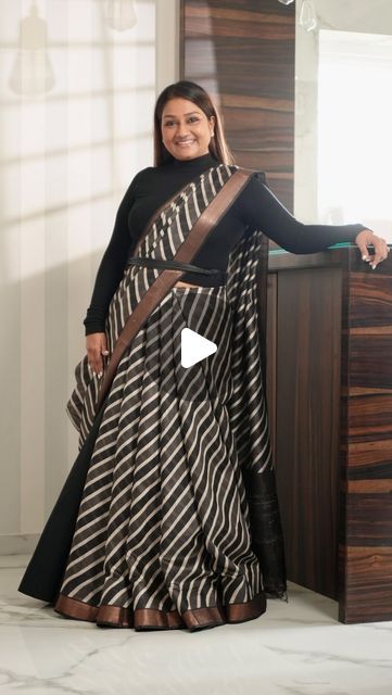 Dolly Jain 🇮🇳 on Instagram: "#SAREELS 425
The reel you’re watching today has a special story behind it. Every reel I create has a message related to a saree, a moment, or an emotion.

About a month ago, I received this saree but due to my constant travel, I didn’t have the chance to open and appreciate it until the day before the shoot. When I finally took a look at it, I instantly fell in love with the fabric and texture. That’s when I decided to try something different with it instead of the usual drape. I opted for a unique D’Coat bell style.

It was a fun experience draping this saree with the D’Coat bell. The first shot in the reel was actually taken without me noticing, as I was completely absorbed in the music playing in the background.

Every saree has its own story to tell, and Sarees With Dupatta, Unique Ways To Drape Saree, Unique Saree Draping Style, Two Saree Draping Styles, Different Saree Drapes, New Style Saree Draping, Saree With Dupatta Draping, Saree With Coat, Dupatta Draping Styles On Suit