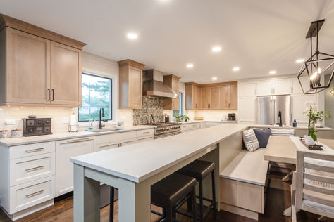 In order to open the first floor up, our team had to absorb the dining room into the kitchen, which meant our designer had to be intentional in creating an eating area that was fluid with the space. This led to the island banquette that the kitchen now evolves around. It has extended barstool seating that can be pulled out to accommodate more people and lots of storage as the gathering spot is all drawers. Extended Kitchen Island With Seating, Extended Kitchen Island, Kitchen Island Banquette, Island Banquette, Extended Kitchen, Dining Banquette, Beach Kitchen, Eating Area, Beach Kitchens