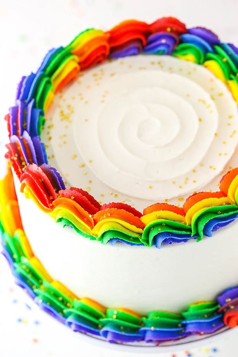 Rainbow Swirl Cake made with three layers of homemade rainbow cake, then decorated with rainbow swirl frosting around the edges! An amazing birthday cake! #rainbow #cake #rainbowcake #rainbowdessert Pride Birthday Cakes, Pride Cake Decorating, Rainbow Swirl Cake, Swirl Frosting, Rainbow Icing, Rainbow Kingdom, Kids Birthday Party Cake, Rainbow Desserts, Cake Rainbow