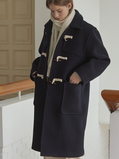 Editor's NotesThis is a plain duffle coat designed in a semi-oversized fit. It's a classic duffle coat design that stands out with a relaxed and stable silhouette. - Offering a casual yet feminine image  versatile for coordination with various inner layers- With big-sized front outer pockets to enhance the practicality- The coat enhanced with front bonding processing for higher quality* Imperfections in thread trimming  due to being done by hand  during the manufacturing process are not considered defects.Measurements(in.)One Size(XS-M)- Total Length: 42.13 in.- Chest: 23.82 in.- Shoulder: 19.49 in.- Sleeve Length: 22.24 in.- Sleeve Width: 6.69 in.* Model info: Height 5â 74â Bust 32.5â Waist 25' Hip 35'* Measurements are based on one si Oversized Coat Outfit, Navy Winter Coat, Duffel Coat, Duffle Coat, Oversized Coat, Coat Design, Coat Outfits, Manufacturing Process, Coat Fashion