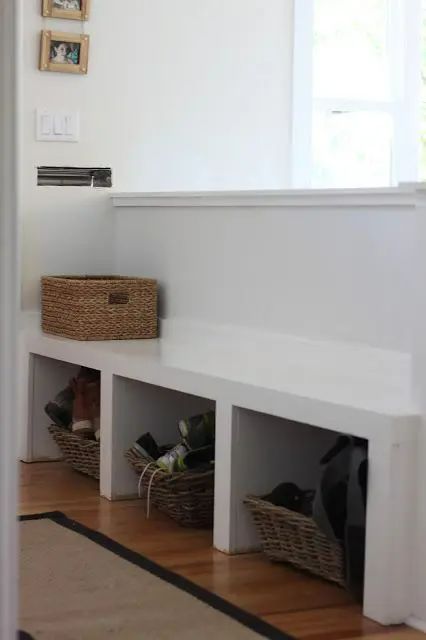 a pony wall with a bench and open storage that separates the entryway and living space Pony Wall Bench Seat, Pony Wall Ideas, Pony Walls, Half Wall Room Divider, Half Wall Ideas, Creating An Entryway, Pony Wall, Half Walls, Renovation Inspiration