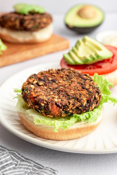 These Black Bean Sweet Potato Burgers are flavorful, easy to make, and are going to be your new go-to veggie burger recipe. Completely vegan and easily made gluten free with a few modifications, these burgers have planted based protein from beans, moisture from baked sweet potato and are bursting with flavor thanks to Dijon mustard and the perfect blend of herbs and spices. Gluten Free Black Bean Burgers, Sweet Potato Black Bean Burger, Plant Based Burger, Easy Veggie Burger, Vacation Recipes, Sweet Potato Veggie Burger, Black Bean Sweet Potato, Veggie Burger Recipe, Sweet Potato Burgers