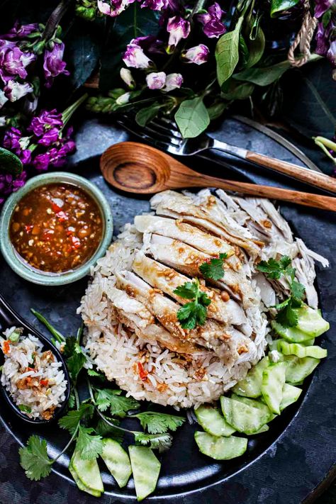 Thai Chicken Rice (Khao Mun Gai) is a classic Thai dish you don't want to miss. Tender chicken is simmered to perfection in a flavorful broth and then served over fragrant rice. The savory dipping sauce combines all the flavors in one addictive bite after another! #khaomungai #kaomungai #authenticchickenrice #thaichickenrice #hainanesechicken #kaomungairecipes #howtomakekhaomungai #chickenricesauce Kao Mun Gai Recipe, Khao Mun Gai Recipe, Khao Mun Gai, Khao Man Gai Recipe, Thai Chicken Rice, Khao Man Gai, Hainanese Chicken, Sauce For Rice, Winter Melon