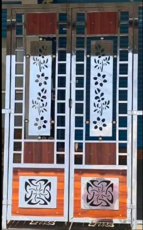 Steel Double Door Design, Ss Gate, Modern Steel Gate Design, Steel Double Doors, Steel Gates, Modern Window Grill, Exterior Door Designs, Stainless Steel Gate, Gate Wall Design