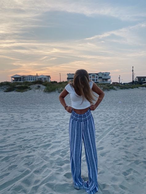 sunset pictures, sunset pics, beach, sand, ocean, the shore, outfit inspo, sunset outfit inspo, date inspo, beach aesthetic, flowy pants, long pants, blue aesthetic, striped pants, summer pants, crop tops, white tops, family pictures, golden hour, teenage summers, instagram pictures, vsco aesthetic Blue Beach Pants Outfit, Blue Flowy Pants Outfit, Shore Outfit, Flowy Pants Outfit, Date Inspo, Beachy Pants, Sunset Outfit, Hawaii Outfits, Cozy Pants