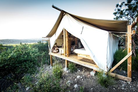 Glampers will feel as if they've been transported to Africa in this lovely luxury safari cabin tent near Warner Springs in Southern California. Filled with exotic furniture built by the owners or brought back from their travels, this glamping accommodation exudes sumptuousness—don't forget the incredible views of the surrounding landscape from both the bedroom and the bathroom. Imagine taking a warm bubble bath with a cup of coffee in the morning or a glass of wine in the evening, sta... Glamping California, Head Scratcher, Zelt Camping, Camp Site, Go Glamping, Cabin Tent, Glamping Site, Safari Tent, Bug Spray