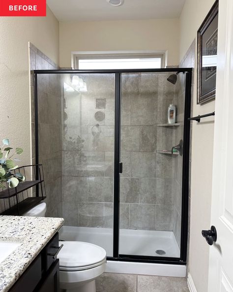 Black framed glass shower door in bathroom before renovation. Shower Room Glass Door, Framed Glass Shower Doors, Obscure Glass Shower Doors, Glass Stand Up Shower Ideas, Black Shower Frame Bathroom, Bathroom With Black Shower Door, Paint Grasscloth Wallpaper, Sliding Shower Door Makeover, Shower Next To Vanity