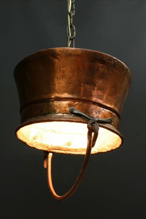 One-of-a-kind antique copper pot converted into a unique hanging light. We found this copper cauldron/pendant light here in Belgium and date it late 1800s to the turn of the century. Copper Light Fixture, Copper Kitchen Decor, Copper Kettle, Restaurant Lighting, Copper Chandelier, Deco Luminaire, Copper Pots, Copper Kitchen, Rustic Lighting