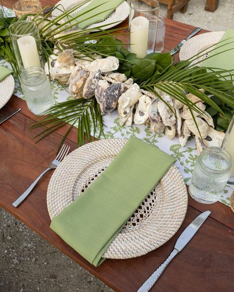 Nothing says a rustic, waterfront reception quite like the details of this tablescape. We used oyster shells and natural greenery to embrace the essence of the space and provide a balance of both class and fun. 🌱 #tablescape #eventplanner #weddingflorals #southernwedding Element Table, Oyster Roast, Farmhouse Wedding, Coastal Wedding, Oyster Shells, Long Table, Wedding Table Settings, Wedding Tablescapes, Southern Wedding