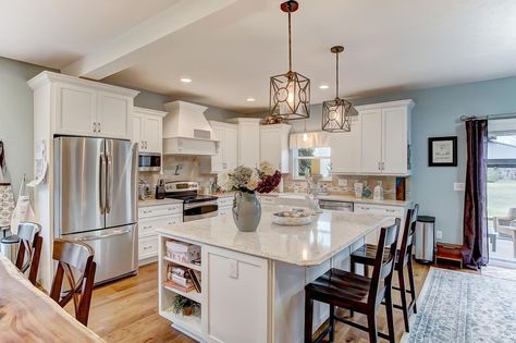 White kitchen with light blue walls and natural wood floors Decorating A Kitchen, Country Kitchen Backsplash, Light Blue Kitchen, Small Country Kitchens, Natural Wood Floors, White Kitchen Lighting, Blue Kitchen Walls, Blue Kitchen Designs, Country Farmhouse Kitchen Decor