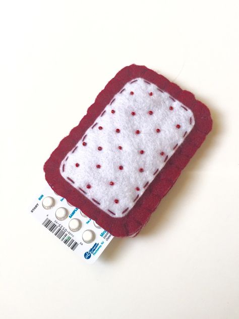 The Original Toaster Pastry Pill Case was featured in an article! Check it out here: http://www.buzzfeed.com/juliareinstein/birth-control-cozies#.smABr9aLQ Finally a discreet way to store your birth control pills! No more using those ugly plastic sleeves that come with your pack. Also a a great way to spot your pack quickly in your purse. This cozy is hand stitched with maroon & white felt featuring tiny "sugar" beads. Fully lined in a soft white felt. The case pictured is for a small pack of pills that fits products such as Minastrin 24 Fe and Lo Loestrin Fe, etc. (Pill case size approx. 2" x 3 1/2" inches.) Case measures approx: 3 1/2" w x 4" t. Each case is tested for size with a brand new pill pack. Made to fit snug! If you need a different size please send me an Etsy convo or leave a Birth Control Case, Pill Pack, Resolution List, Toaster Pastry, Sugar Beads, Birth Control Pills, Pill Case, Birth Control, Coin Purses