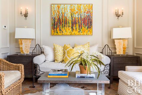 While decorating with yellow is usually the realm of cottage-style spaces, the hue can take an elegant turn when used on sumptuous materials and in constrained doses. In this living room, silk pillows color a pretty daybed. The color travels to a pair of agate chunk lamps and abstract painting overhead. What Color Goes With Yellow, Cream Colored Walls, Yellow Accent Wall, Wardrobe Colour, Aries Sun, Colored Walls, Yellow Sofa, Vastu Tips, Yellow Living Room