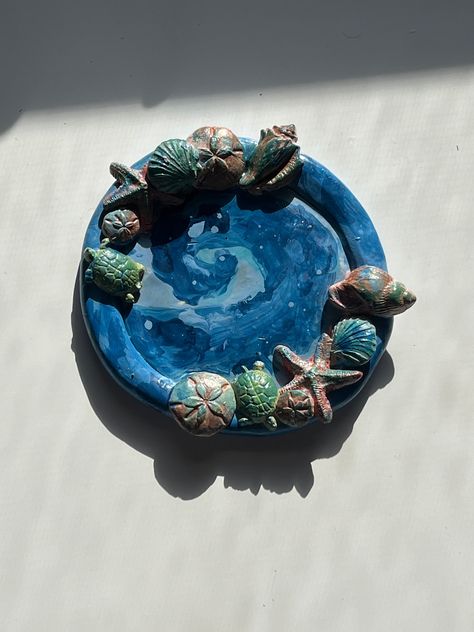 Cute ocean inspired jewelry holder, perfect for earrings or bracelets. All handmade and hand painted. Ocean Ceramics, Clay Jewelry Holder, Ceramic Jewelry Holder, Clay Jewellery Holder, 4h Projects, Octopus Jewelry, Clay Bracelets, Ocean Gifts, Pottery Inspo