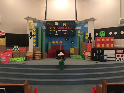 Power Up VBS main stage Video Game Stage Design, Mario Vbs, Power Up Vbs, Mario Vbs Decorations, Twist And Turns Vbs, Vbs Twists And Turns Decorations, Vbs 2023 Twists And Turns Decorating Ideas, Vbs 2023 Twists And Turns Decorations, Twist And Turns Vbs 2023 Decorations