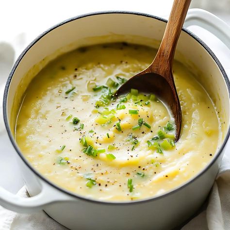 This creamy and comforting potato leek soup, packed with tender potatoes, savory leeks, and a touch of cream, is sure to warm you up this fall! Potato Soup Leek, Cream Of Leek Soup Recipes, Potato Leek Soup Crock Pot, Slow Cooker Potato Leek Soup, Cream Of Leek Soup, Potato And Leak Soup, Leeks And Potatoes, Creamy Potato Leek Soup, Potato And Leek Soup