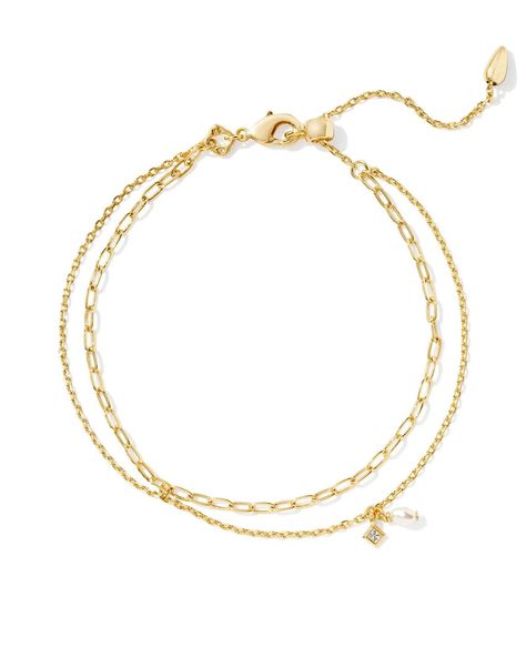 Stack up a style that’s dainty, chic, and full of shine with the Kendra Scott Eve Gold Multi Strand Bracelet in White Pearl. https://thetwistedchandelier.com/products/kendra-scott-eve-multi-strand-bracelet-gold-white-pearl Kendra Scott Charm Bracelet, Kendra Scott Bracelet Stack, Types Of Chains, Wishlist Ideas, Kendra Scott Bracelet, White Pearl Bracelet, Kendra Scott Necklace, Copper Pearl, Multi Strand Bracelet