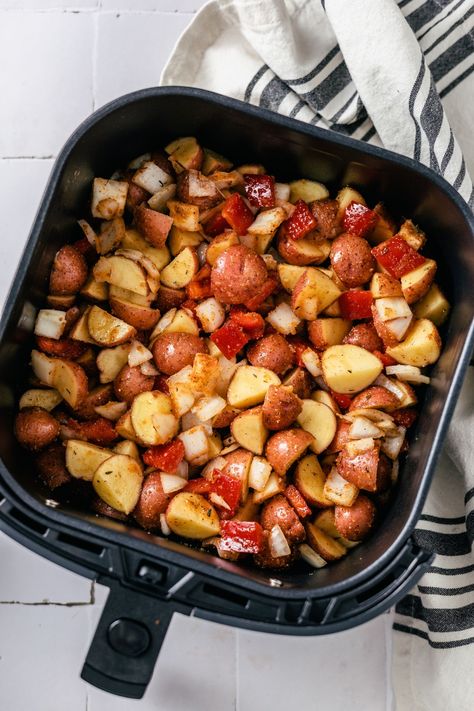 These air fryer breakfast potatoes with onions and peppers are a great way to enjoy crispy golden brown seasoned potatoes using minimal oil. Learn how to make this simple side dish, plus get more air fryer breakfast recipes.