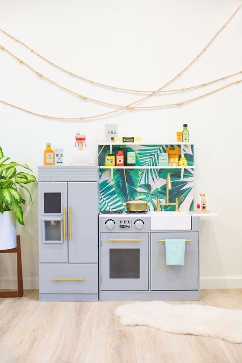 Check out this fun IKEA hack to create a kids' play kitchen! This play kitchen makeover is full of tips & ideas and has a full DIY tutorial for applying wallpaper, extra storage, food and accessories. And see the one secret we used to make a magnetic area! #playkitchen #ikeahack Diy Kids Kitchen, Play Kitchen Accessories, Play Kitchens, Kids Play Kitchen, Diy Play Kitchen, Mason Jar Crafts Diy, Little Kitchen, Diy Interior, Kids Kitchen