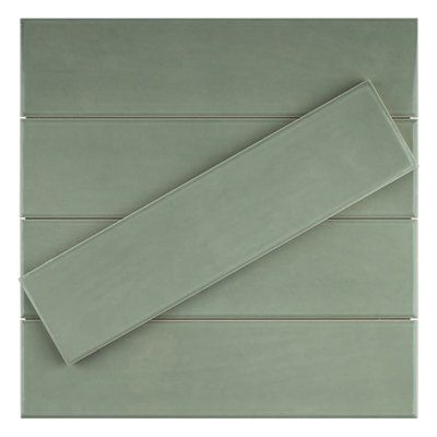 Zarati 3" X 12" polished ceramic subway wall tile is a perfect combination of classic and contemporary design. The tile is made of ceramic and has a polished finish that reinforces a high-end visual. The tile is ideal for kitchen backsplashes, showers, and bathrooms. The tile is 3" X 12" in size and can be installed in a variety of patterns. Color: Jade Green | Supreme Tile Zarati 2.95" x 11.81" Ceramic Wall Tile Ceramic in Green | 11.81 H x 2.95 W x 0.39 D in | Wayfair Sage Green Kitchen Tiles, Green Kitchen Tiles Backsplash, Matte Tile Backsplash, Sage Tile, Green Kitchen Backsplash, Green Subway Tile, Green Backsplash, White Tile Backsplash, Brown County