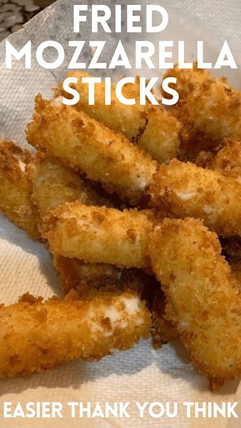 In a medium bowl, combine bread crumbs, 1 cup Parmesan cheese, and salt. Cut each mozzarella stick in half. Beat the eggs in a shallow bowl and dip the cheese sticks into the eggs to coat completely and allow the excess egg to drip into the bowl. Coat the cheese in the breadcrumb mixture, tapping to adhere and coat completely. Repeat dipping the cheese sticks in the egg and breadcrumb mixture to coat a second time. Place cheese sticks on a baking sheet, cover, Homemade Fried Mozzarella, Homemade Cheese Sticks, Fried Mozzarella Sticks, Fried Cheese Sticks, Homemade Mozzarella Cheese, Homemade Mozzarella Sticks, Fried Mozzarella, Popcorn Recipes Easy, Mozzarella Sticks Recipe