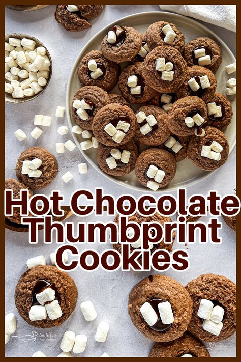 Indulge in the decadence of these Hot Chocolate Thumbprint Cookies. Classic chocolate thumbprint cookies have a fudgy center and are topped with marshmallows for a cookie bursting with the flavor of hot chocolate. Christmas Sweets Recipes, Strawberry Ideas, Chocolate Thumbprint Cookies, Sweet Bakes, Heart Recipes, Thumbprint Cookies Recipe, Cookie Recipes Unique, Hot Chocolate Cookies, Cookie Spread