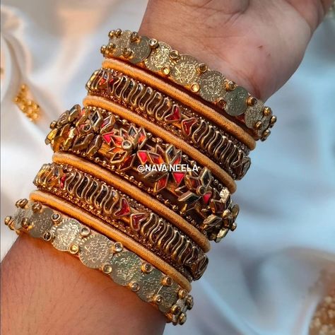 Golden orange lilies in radiant glow, 🌸🍂 Elegant designs in a bridal flow, ✨ A grand beauty the world will know. 👰‍♀️👑 . . . Design Code - Nava0103 . . “Get yours now in your favorite color! 🎨✨" . . "Customize bangles with raw silk thread! 🎨💫@nava.neela" . . DM us on Instagram or WhatsApp to 8300830771 . . #navaneela #bangles #silkthreadbangles #silkthreadjewelry #kundanbangles #weddingbangles #bridalbangles #returngifts #festivebangles #southindianbangles #bride #bangleset #weddinginspiratio... Orange Lilies, Kundan Bangles, Silk Thread Jewelry, Silk Thread Bangles, Thread Bangles, Bangles Indian, Bridal Bangles, Elegant Designs, Bangle Set