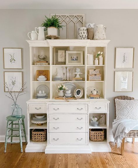 Beautiful stylings with a hint of spring for your viewing pleasure! This feature wall decor style is simply amazing, so inspiring, right?⁠ We Spy an AFH WINDOW WALL DECOR⁠ in this gorgeous display too! #homedecor #walldecor Hutch Decorating Ideas Farmhouse, Living Room Hutch Decorating Ideas, Hutch In Living Room, Farmhouse Hutch Decor, Kitchen Island Corbels, Hutch Decorating Ideas, Living Room Hutch, White Hutch, Hutch Ideas