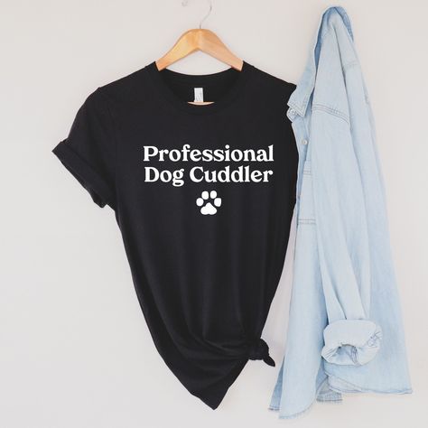 Dog Daycare worker, dog walker, dog rescue volunteer, professional dog cuddler. Funny Dog Shirt. Dog themed tshirt. Dog Cuddler funny dog quote tee. Cute and Trendy dog lover gift. Professional dog cuddlers include anyone who loves dogs, owns dogs, rescues dogs, etc. This updated unisex essential fits like a well-loved favorite. Super soft cotton and excellent quality print makes one to fall in love with it over and over again. .: Retail fit .: 100% Soft cotton (fibre content may vary for differ Dog Daycare Design, Daycare Worker, Dog Rescue Shirts, Dog Cuddles, Dog Quotes Funny, Funny Dog Shirts, Cute Shirt Designs, Dog Daycare, Weekend Plans