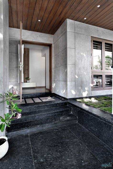 Large Fenestrations Bringing Out The Beauty Of This Residence | Manoj Patel Design Studio Residence Entry Design, Balcony Granite Flooring Ideas, House Entrance Design, Floor Inlay, Entrance Foyer Design, Box Planters, Podium Design, Exterior Wall Tiles, Wooden Backdrops