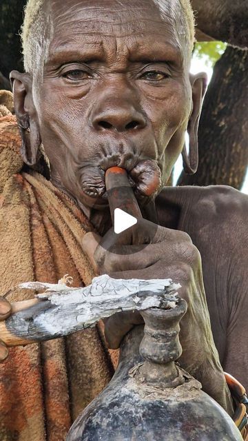 Mamaru Ethiopian Tours on Instagram: "Old Surma/Suri Tribe Woman smoke tobacco from traditional pipe.

.

.

.

#Ethiopia #OmoValley #omoriver #tribes #mamaruethiopiantours #mamarulocalguide #omovalleytribes #omovalleytour #omovalleylocalguide #africa #travel #travelblogger #travelafrica #travelethiopia #seeafrica #visitafrica #facepainting #africantribes  #mamaru #mamaruendris #tobacco #pipe #suri #surmatribe #suritribe #surmatribes #visitomovalley #omoadvisor" Suri Tribe, Ethiopian Tribes, Visit Africa, Africa Travel, Ethiopia, Travel Blogger, Travel, Instagram