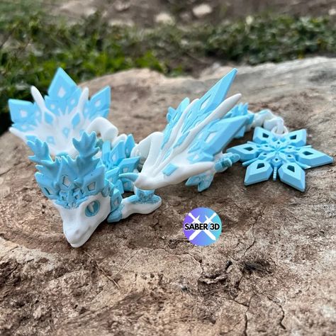 Articulated Baby Snowflake Dragon by Saber3D by Saber3D - MakerWorld Articulated Dragon 3d Print, 3d Printed Dragon, Baby Dragons, Dragon 3d, New Dragon, Baby Dragon, Cozy Christmas, Christmas Prints, 3d Printer