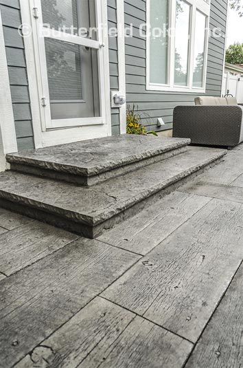 Cement Patio Stairs, Wood Stamped Concrete Patio Ideas, Stamped Concrete Patio Ideas Wood Plank, Wood Plank Stamped Concrete Patio, Concrete Patio Ideas With Steps, Patio Steps From House, Cement Stamping, Stamped Concrete Steps, Wood Grain Concrete