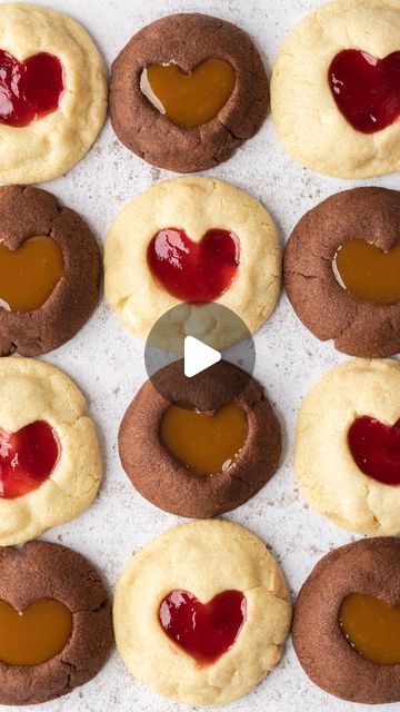 Jessie | Baking Content Creator on Instagram: "NEW RECIPE 😍 Thumbprint Heart Cookies! Which flavour has your heart?❣️    You seemed to love my chocolate dipped heart shortbreads so I’m hoping you’ll love this recipe just as much 🫶 For the best flavour I used Menier White Chocolate for the jammy cookies and Menier 100% cocoa powder for the chocolate salted caramel cookies • AD 🍫 Enjoy!    ❤︎ INGREDIENTS (makes 8 of each flavour) ❤︎    White chocolate raspberry heart cookies:  • 125g unsalted butter, room temp  • 100g caster sugar  • 200g plain flour  • 50g @menierchoc White Chocolate, chopped into small chunks  • 60g raspberry jam    Chocolate salted caramel heart cookies:  • 125g unsalted butter, room temp  • 100g caster sugar  • 180g plain flour  • 20g Menier 100% Cocoa Powder  • 60g s Jammy Cookies, Chocolate Salted Caramel Cookies, Heart Cookies Recipe, Thumbprint Heart, Salted Caramel Cookies, Caramel Cookies, White Chocolate Raspberry, Heart Cookies, Caster Sugar