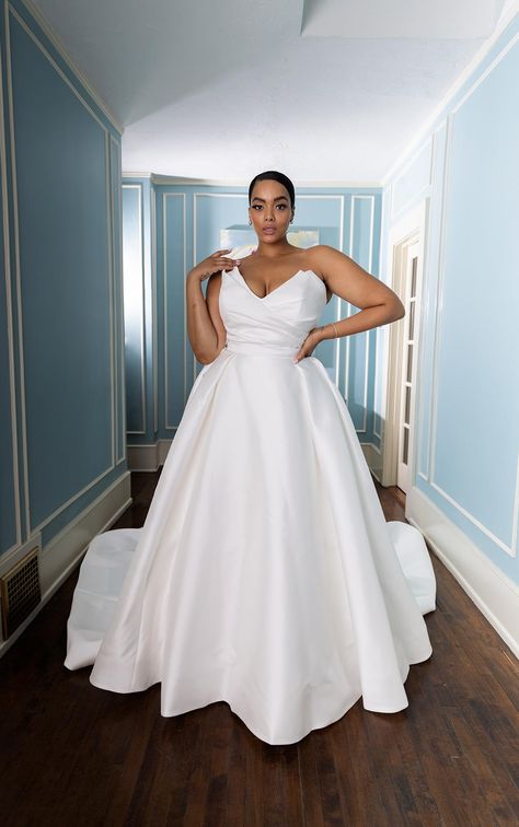 Simple, modern and oh-so-chic, Style 1557 takes timeless bridal design and adds a luxurious, glamorous twist. This show-stopping plus size wedding gown is constructed in sumptuous ivory silk zibeline Plus White Wedding Dress, Simple Wedding Dresses Plus Size, Classic Wedding Dress Timeless Classy Plus Size, Plus Size Plain Wedding Dress, Plus Size Wedding Dresses Curvy Bride Ball Gowns, V Neck Satin Wedding Dress, Simple Plus Size Wedding Dresses, Wedding Gown Plus Size, Silk Plus Size