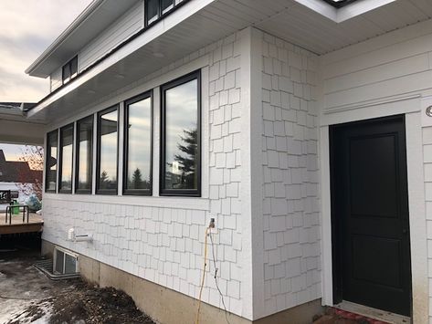 Arctic White Hardie Shingle is used to mix up the design on this modern farmhouse renovation. Different aesthetic, same maintenance cycle. Arctic White Hardie Siding, Modern Farmhouse Siding, Farmhouse Siding, Shingle House Exterior, Hardie Shingle Siding, Modern Farmhouse Renovation, Shingle House, Hardie Siding, Pretty Houses