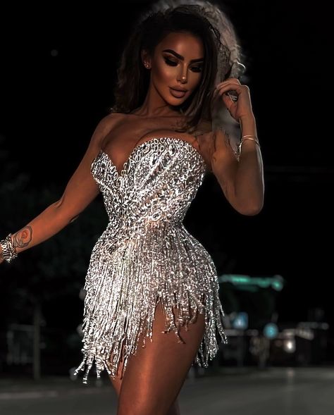 To purchase this gown, send us a DM at @reineecouture. Shine bright in this captivating silver mini dress, designed for those who love to stand out. The sweetheart neckline beautifully highlights the décolletage, adding a touch of elegance. Intricately adorned with shimmering sequins, the bodice sparkles with every movement, ensuring all eyes are on you. The dress's fitted design enhances your natural silhouette, creating a flattering and feminine shape. The short hemline adds a playful tou... Custom Made Dresses, Silver Mini Dress, Dazzling Dress, Sequin Short, Exquisite Gowns, Glamorous Party, Strapless Sweetheart Neckline, Embellished Gown, Glamorous Dresses