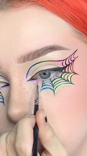 Maddy Harms 🥀 🦇 on Instagram: "🖤🌈🕷🕸 day 14 of 31 days of halloween!! spiderweb liner but in rainbow this time ;) i couldn’t resist! inspo from @deathbeds_uwu 🥰 ________________________________ PRODUCTS: @glisten_cosmetics wet liners @flutterlashesinc artistic lashes @freck xl freck pen @rarebeauty power boost bronzer stick @colourpopcosmetics kiss n tell blush #halloweenmakeup #31daysofhalloween #graphicliner #graphiceyeliner #eyeliner #makeuptutorial #makeup #makeupreels #makeupvideos" Wet Liner Looks, Spiderweb Liner, Halloween Graphic Liner, Halloween Eyeliner Looks, Spiderweb Makeup, Spiderweb Eyeliner, Spider Web Makeup, Glisten Cosmetics, Bronzer Stick