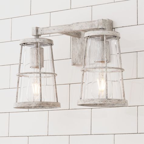 Combining blown glass, rope accents and rustic charm, this collection complements a myriad of styles from modern farmhouse and urban loft to classic colonial and coastal cottage. This bathroom wall light is perfect for updating a beach house bathroom or bringing the essence of the coast to any bathroom vanity. Inspired by light houses, fishing buckets and other nautical elements, these lighting fixtures manage to tie into themes that go beyond coastal. Caravan Garden, Cottage Vanity, Beach House Lighting, Nautical Elements, Beach House Bathroom, Coastal Farmhouse Decor, Coastal Lighting, Light Ideas, Coastal Bathrooms